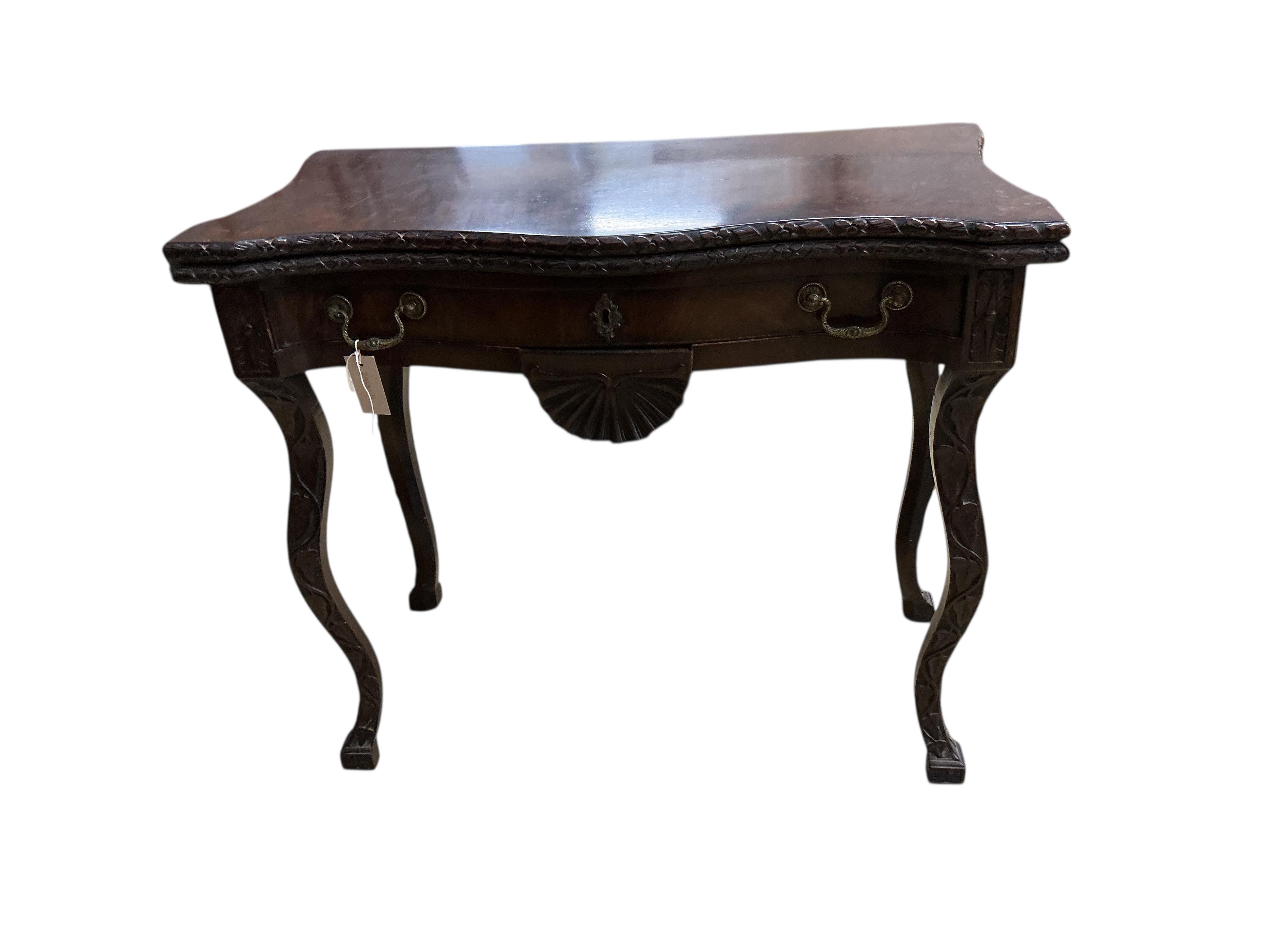 A George II style serpentine mahogany folding card table, width 86cm, depth 43cm, height 73cm
